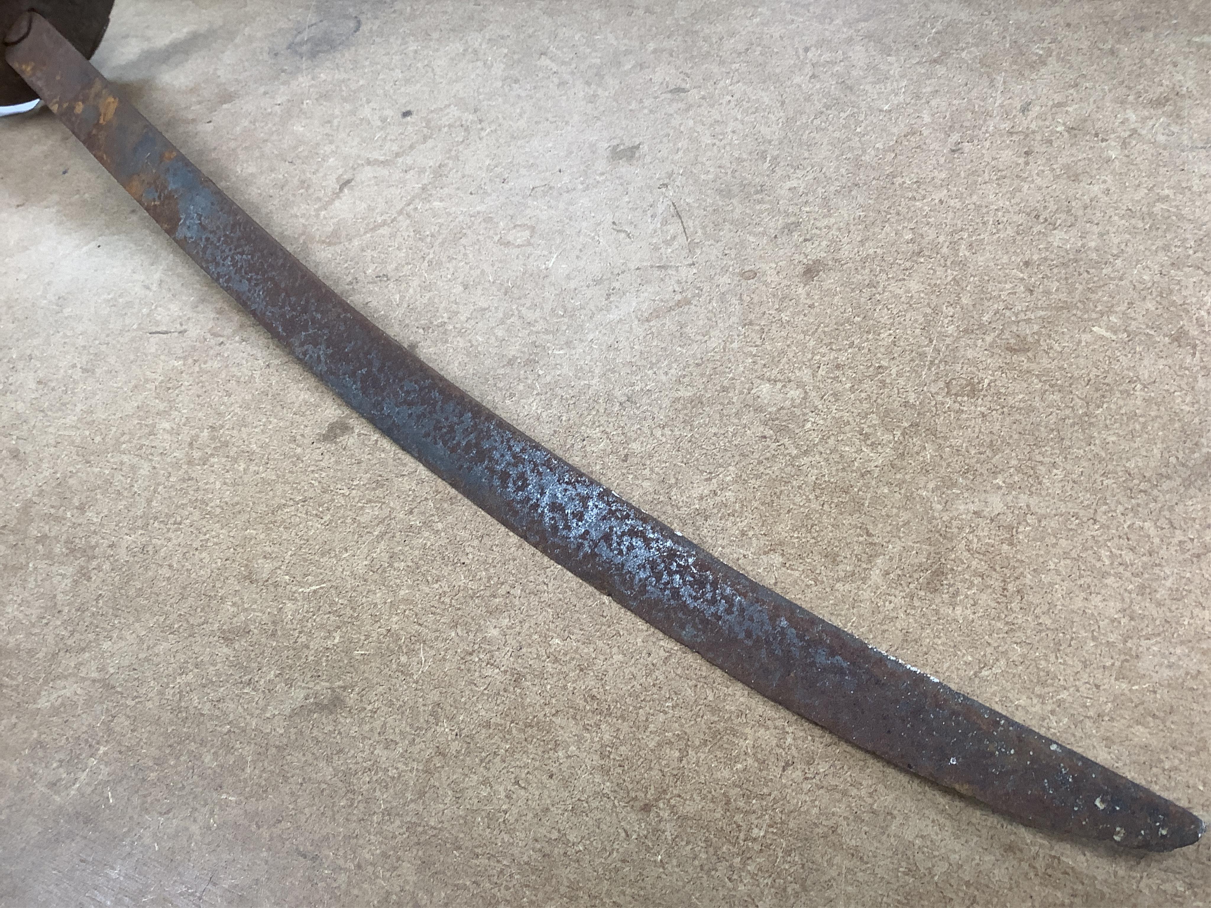 An English Civil War period cavalry officer’s sabre, curved single edge blade, struck with crescent moon, ‘mortuary’ hilt chiselled with scrolling foliage, swollen chiselled pommel, wooden grip, blade 71.5cm. Condition -